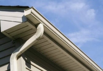 Close-up of gutter, downspout elbow and soffit detail