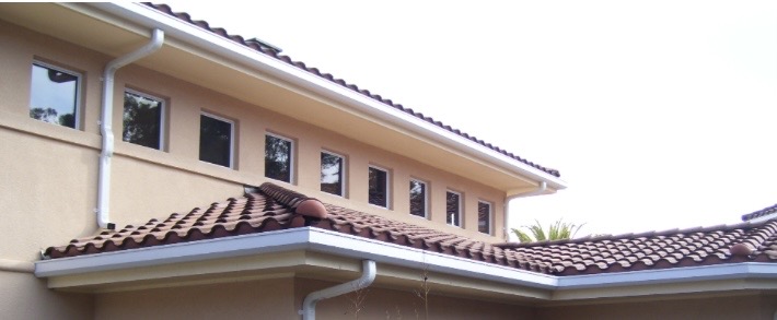 Continuous gutter run on a tile-roof home